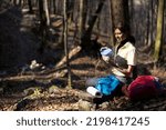 Small photo of Female Tourist Hiker Taking a Break For A Prepared Meal that She Toke With Her on Walk