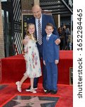 Small photo of LOS ANGELES, CA. February 21, 2020: Dr. Phil McGraw & grandkids Avery Elizabeth McGraw & London Philip McGraw at his Hollywood Walk of Fame Star Ceremony Pictures: Paul Smith/Featureflash