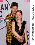 Small photo of LOS ANGELES, CA - November 19, 2017: Madelaine Petsch & Travis Mills at the 2017 American Music Awards at the Microsoft Theatre LA Live