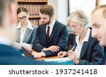 Small photo of Team of partners in a law firm working diligently on a case