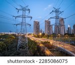 high-voltage power lines. high voltage electric transmission tower at night