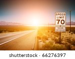 Highway road to sunset. 70 MPH speed limit sign.