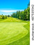 Small photo of Golf course and a red flag in a sunny day. Canada, Vancouver.