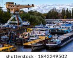 Small photo of Budapest Hungary Oct. 24, 2020: Old shipyard and boats. Dismounting dock. Vintage river cruisers and pleasure craft are maintained and dismounted here.