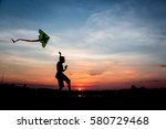 Silhouette Boy Flying A Kite In ...