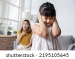 Angry Asian Mother Yelling at Her Stubborn Daughter For Domestic Violence Concept