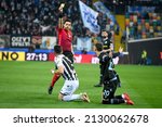 Small photo of Udine, Italy, February 20, 2022, The referee of the match Luca Massimi shows yellow card to Udinese's Tolgay Arslan after the foul on Lazio's Mattia Zaccagni during italian soccer Serie A match Udines