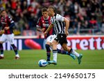 Small photo of Bologna, Italy, April 24, 2022, Udinese's Gerard Deulofeu in action against Bologna's Nicolas Dominguez during italian soccer Serie A match Bologna FC vs Udinese Calcio