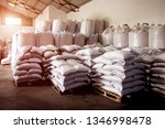 Abstract agrarian image with bags of grain in the agricultural sector in the farm. (good harvest, abundance - concept)