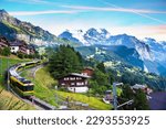 Beautiful mountain landscape with train in canyon of the city Lauterbrunnen in the Swiss Alps, Switzerland. Amazing places.