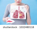 Small photo of woman take sick lung billboard on the blue background