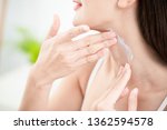 young beauty woman applying cream or sunscreen on her neck