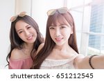 women selfie and smile happily in the shopping mall