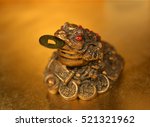 three legged toad with gold coin | Shutterstock . vector #521321962