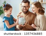 Small photo of family savings, budget planning, children's pocket money. family with piggy Bank moneybox