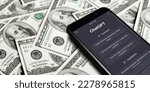 Small photo of Website of ChatGPT on screen smartphone on background of dollars. ChatGPT is a chatbot by OpenAI. Moscow, Russia - March 22, 2023.