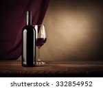 Red Wine Bottle And Glass On A...