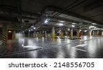 Small photo of View of a large underground parking lot, focus anyhow