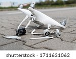 Crashed modern drone and camera after drone accident