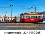 Small photo of Lisbon, Portugal - August 31, 2022: Vintage tram for hills tramcar tourist tour on Commerce Square in street of Lisbon, Portugal