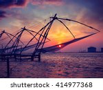 Small photo of Vintage retro effect filtered hipster style image of Kochi chinese fishnets on sunset. Fort Kochin, Kochi, Kerala, India