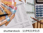 Purchasing order with euro banknotes and calculator