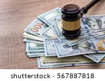 wooden gavel with usa dollar on desk. close up. macro