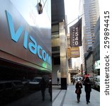 Small photo of NEW YORK CITY - FEB. 25, 2015: A pedestrian walks past the headquarters of Viacom. Viacom, Inc. is an American global mass media company