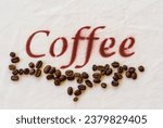 Small photo of Stenciled Coffee sign in burnt umber and real whole coffee beans on cream calico