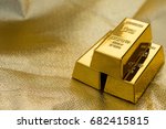 Three Pieces Of Gold Bars On A...