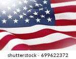 closeup of rippled american flag | Shutterstock . vector #699622372