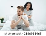 Small photo of Loving woman giving her despondent partner soothing massage
