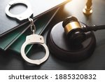 Handcuffs and wooden gavel....