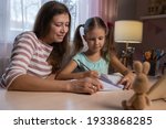 mother and daughter doing... | Shutterstock . vector #1933868285