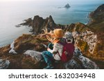 Woman relaxing alone travel in Norway adventure vacations healthy lifestyle backpacking Vesteralen landscape rocks and sea aerial view