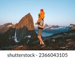 Family travel father with daughter child piggyback outdoor hiking in Norway together healthy lifestyle trip Segla mountain landscape active vacations dad and kid Father's day holiday