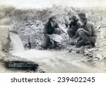 Small photo of Three men, with dog, panning for gold in a stream in the Black Hills of South Dakota in 1889. Old timers, Spriggs, Lamb and Dillon may be die hard survivors from the Gold Rush of 1876.