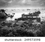 Landing craft of supply U.S. forces on Okinawa, 13 days after the initial invasion. Beyond are U.S. battlewagons, cruisers and destroyers. April 13, 1945.