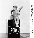 Little Boy Sitting On Powder Keg