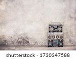 Small photo of Retro old school design ghetto blaster boombox stereo radio cassette tape recorders from 80s front concrete wall background. Nostalgic Rap, Hip Hop, R&B music concept. Vintage style filtered photo