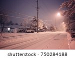 Snowy Suburban Street At Night