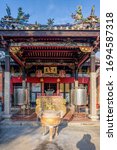 Small photo of PENANG, MALAYSIA - Oct 18, 2017: Incense burner in the front of entrance of Snake Temple (Hock Kin Keong). It was built for the worship of the deity Cheng Chooi Chor Soo, a chinese Buddhist monk.