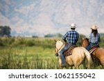 A Couple Horseback Riding From...