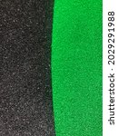 Small photo of Rubber flooring for playgrounds to prevent injury to young children, black and green Ethylene Propylene Diene monomer rubber granules.
