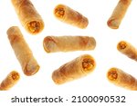 Vegetable spring rolls flying on isolated white background full and cut.