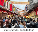 Small photo of Taipei City, Taiwan - Feb 8th,2024: Every year, in the two-week run up to the Lunar New Year break, businesses along Taipei’s Dihua Street hold a special Lunar New Year specialties market.