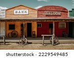 Small photo of Bank and saloon facade in wild western city