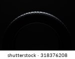 Car tire over black background