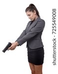 Small photo of business woman pointing a gun down at something on the ground