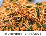 Thai food at market. Fried insects mealworms for snack